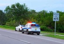 Police car pulling over a white car