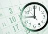 A clock overlaying a calendar, illustrating the concept of time management