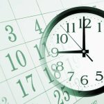 A clock overlaying a calendar, illustrating the concept of time management