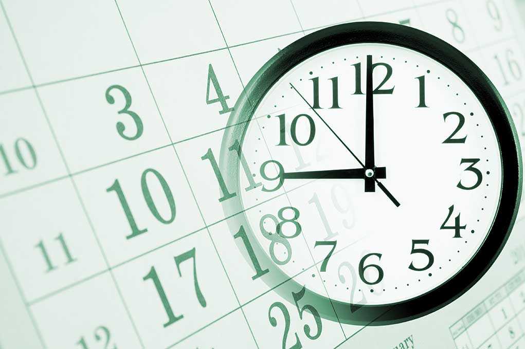 A clock overlaying a calendar, illustrating the concept of time management
