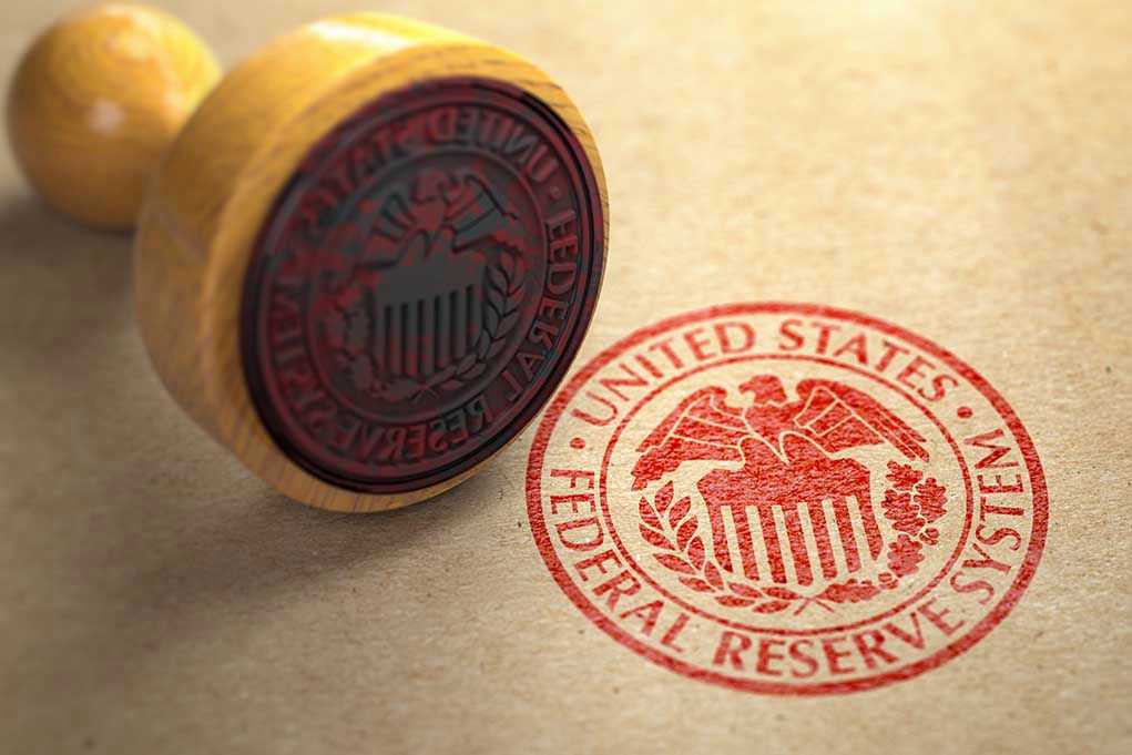 1487540675 Federal Reserve stamp and wooden stamp on paper
