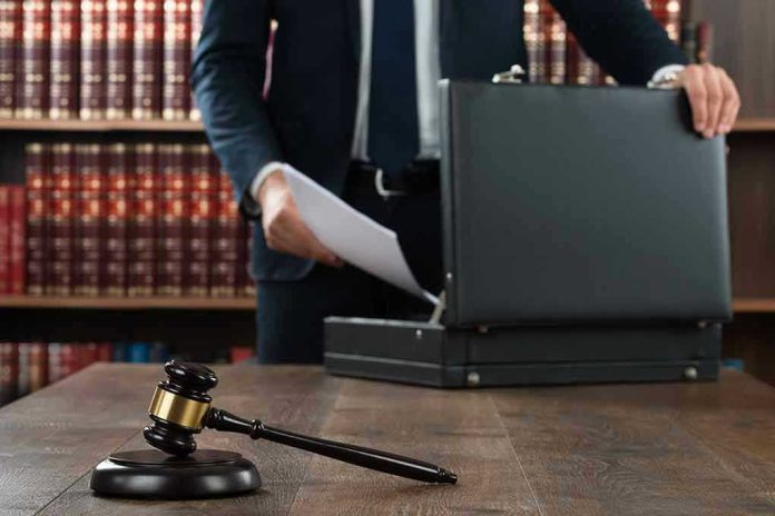 Gavel, lawyer, briefcase, and legal books on the table.