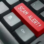 White House Memo EXPOSES $200B Healthcare Scam Close-up of keyboard with red SCAM ALERT key.