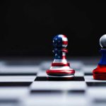 Trump Dares to Tame Putin — Will It Work? Two chess pawns painted as American and Russian flags.