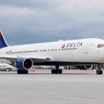 LaGuardia Chaos: Delta Jets COLLIDE on Taxiway Delta Airlines airplane on airport runway, cloudy sky.