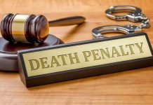 Death Penalty DEMAND—Ex-Prime Minister Vanishes Gavel, handcuffs, and Death Penalty sign on desk.
