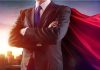 SNAP MELTDOWN — HERO FILLS IN THE GAPS! Businessman wearing a cape, standing confidently.