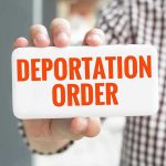 Congress’ $170 Billion ICE Move—How This Translates to DEPORTATIONS Hand holding sign with Deportation Order text.