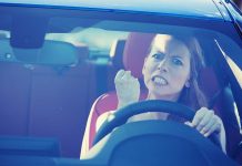 Neighborhood Erupts—Gun Pulled, Kids Caught in Chaos Angry woman gripping the steering wheel in a car