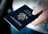 Federal Systems REJECT Valid U.S. Passports A person holding a United States passport with a dark background