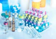 Pharma Boss Collapses—Trump’s Drug Plan Explodes Vials and blister packs of pills on table.