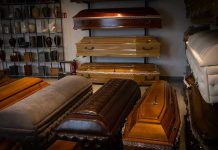 Chilling Murder Exposes Funeral Home Deceit Showroom with coffins and urns.