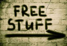 Internal WAR: Democrats’ Socialist Shift Graffiti on brick wall says free stuff arrow