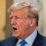 Conservative Panic—Trump Warns “Survival at Stake” Man in suit with open mouth, speaking passionately.