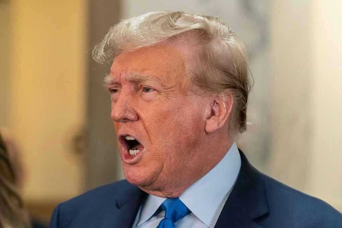 2369816081 Man in suit with open mouth, speaking passionately.