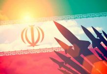 Missile Power Play: Iran’s Defiant Move Silhouettes of missiles over Irans flag graphic.