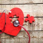 Heart Failure Risk SOARS 90% – Nobody Knew Red heart puzzle with stethoscope on wooden background.
