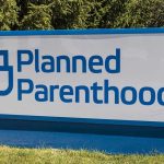Trump’s Bill DESTROYS Planned Parenthood Empire Planned Parenthood sign on a grassy lawn.