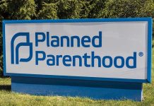 Trump’s Bill DESTROYS Planned Parenthood Empire Planned Parenthood sign on a grassy lawn.