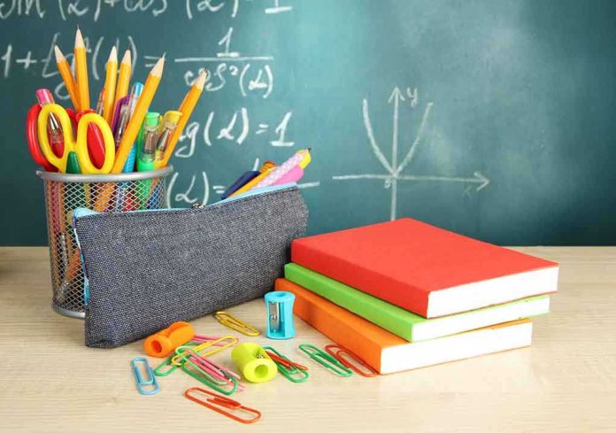 shutterstock_123973744.jpg A collection of school supplies including notebooks, a pencil case, and writing instruments on a desk