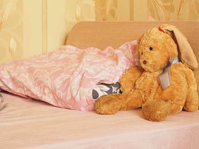 shutterstock_164927786.jpg A cozy bedroom scene featuring a stuffed bunny and pink bedding