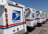 37 Million Packages STOLEN Row of USPS mail trucks parked in lot.