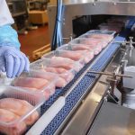 Restaurant Owners FURIOUS Over Plastic Ban In This State Packaged chicken breasts on a factory conveyor belt.
