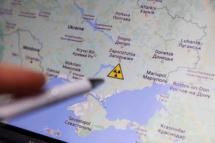 Map of Ukraine with nuclear warning symbol.