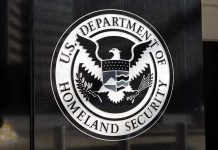 TSA Has a Surprisingly New Enforcement Role U.S. Department of Homeland Security emblem on wall.