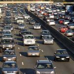 Car Buyers Locked Into Payments They Can’t Escape Heavy traffic on a multi-lane highway.