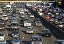 Car Buyers Locked Into Payments They Can’t Escape Heavy traffic on a multi-lane highway.