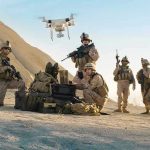 Trump’s New ‘Drone Killer’ Stuns Pentagon Soldiers operating a drone in a desert environment.