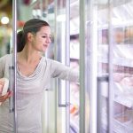 Florida Freezer Hoax EXPOSED—Truth Finally Revealed A woman shopping in the frozen food aisle of a supermarket