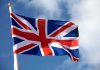 UK Now DEMANDING Discloser Of Private Associations British flag waving against a blue sky