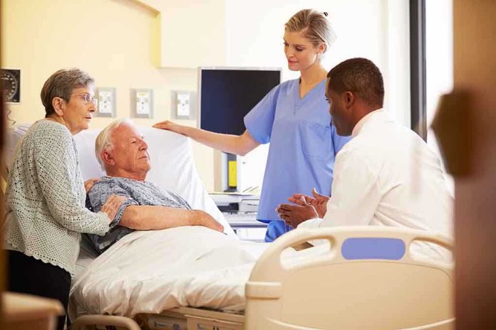 A nurse and a doctor discussing with a patient and his family in a hospital room