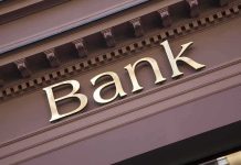 Why Thousands Lost Banking Access Gold bank sign on building facade
