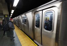 Segregation Demand ERUPTS On LA Subway Man waiting at subway platform with departing train.