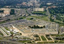 Pentagon’s Secret Weapon Hunts Iranian Boats Aerial view of the Pentagon surrounded by highways and urban areas
