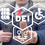 IBM Pays $17M—DEI Hiring Scheme BUSTED Person pointing at DEI symbols on glass.