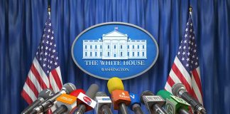 Was Musk, Zuckerberg Linked to Trump’s AI U-Turn? Multiple microphones at White House press briefing podium.