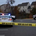 Teen and Accomplice Charged in Triple Family Murder Sheriff line tape blocking scene with police and ambulance.