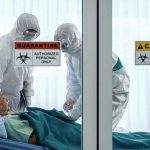 PANIC Aboard Cruise—WHO Chief Races to Crisis Healthcare workers in protective gear in quarantine room.