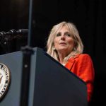 Jill Biden’s Stroke Admission SHATTERS Campaign Narrative Person speaking at podium with Vice President seal.
