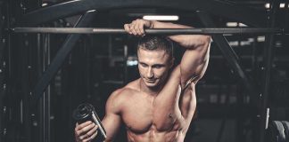 Youth’s Secret Peptide Injections: Shocking Risks Unveiled Muscular man in gym holding a shaker bottle