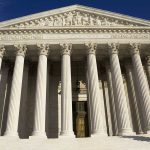 Supreme Court Showdown: Gerrymandering Drama Unfolds Facade of the Supreme Court building featuring tall columns and intricate carvings