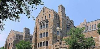 AOC’s Bold Claim Sparks Revolutionary Debate Historic university building with stone facade and surrounding trees