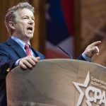 Trump’s Endorsement Test: Will Massie Survive? A politician delivering a speech at a conference podium