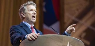 Trump’s Endorsement Test: Will Massie Survive? A politician delivering a speech at a conference podium