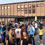 Antifa Storms Campus? Threats Halt Event A large group of students socializing outside a school building