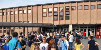 Antifa Storms Campus? Threats Halt Event A large group of students socializing outside a school building
